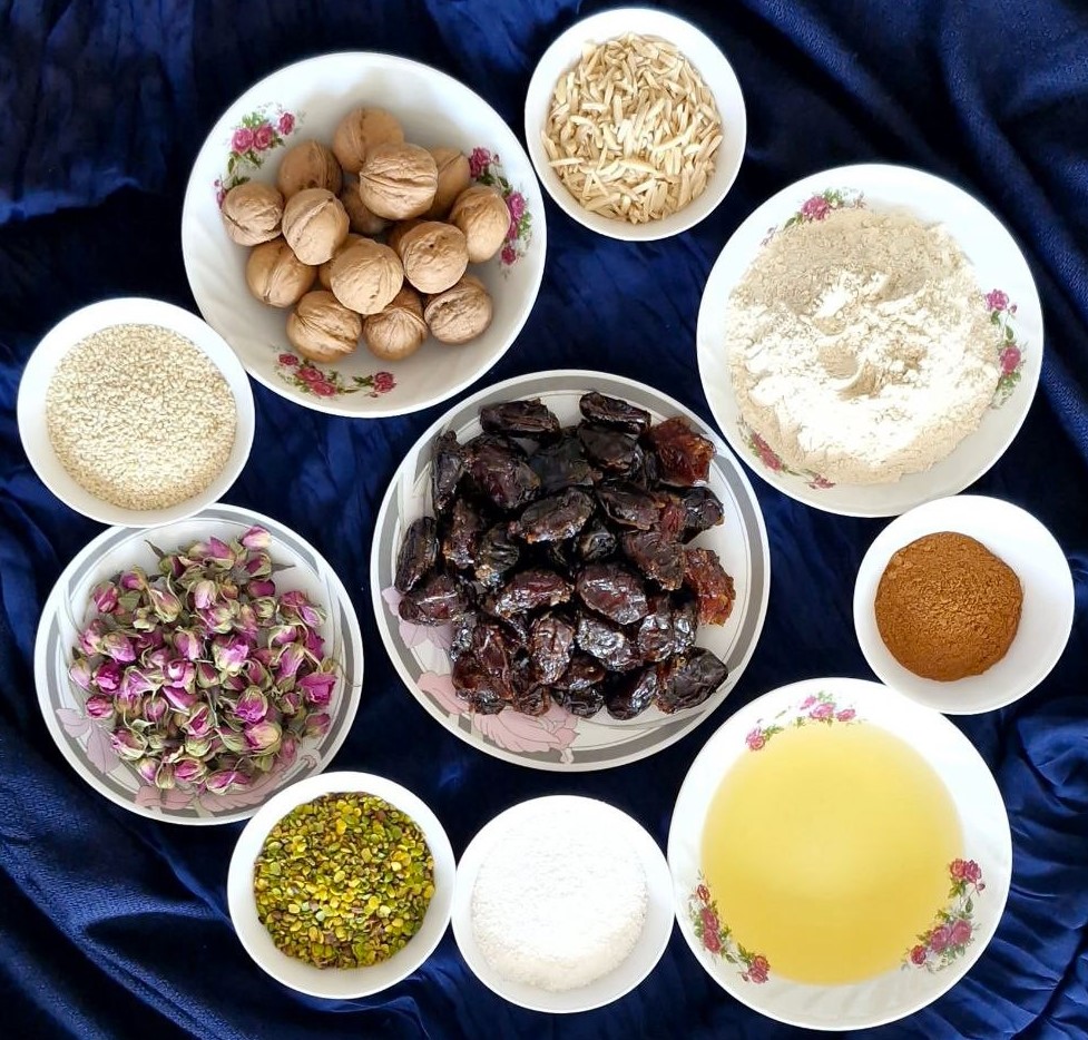 Ranginak Recipe Ingredients Ingredients for Ranginak recipe with dates, walnuts, wheat flour, and cinnamon