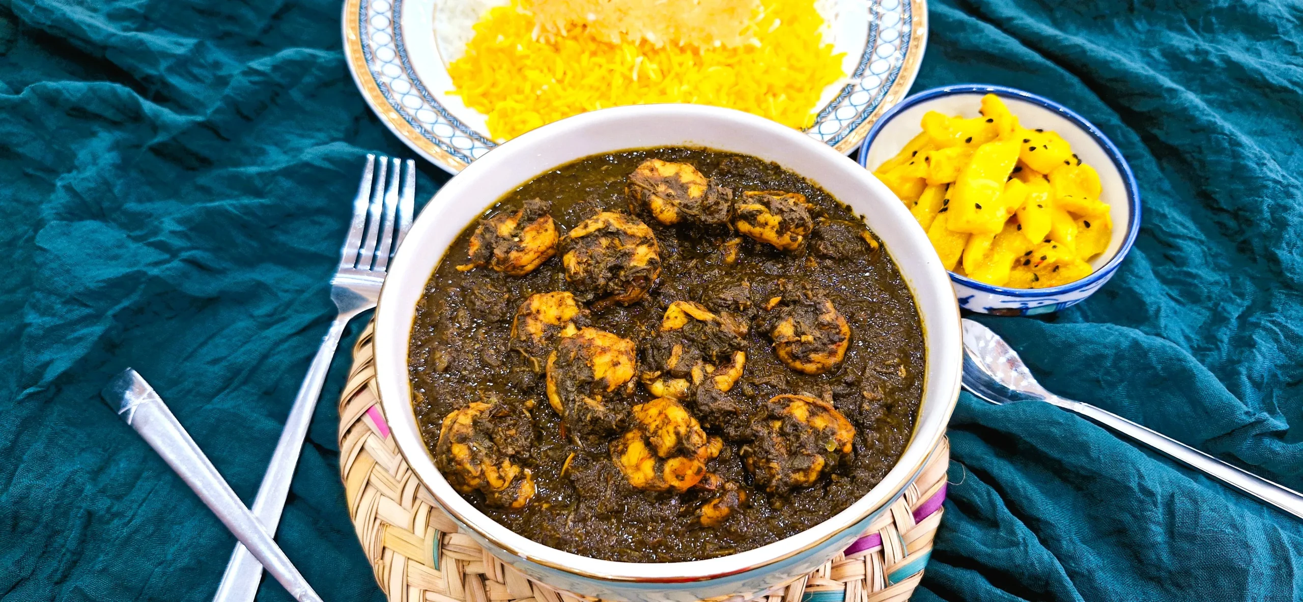 What Is Ghalieh Meygoo? Traditional Ghalieh Meygoo, a Persian shrimp stew made with herbs and tamarind, served with saffron rice and mango pickle.