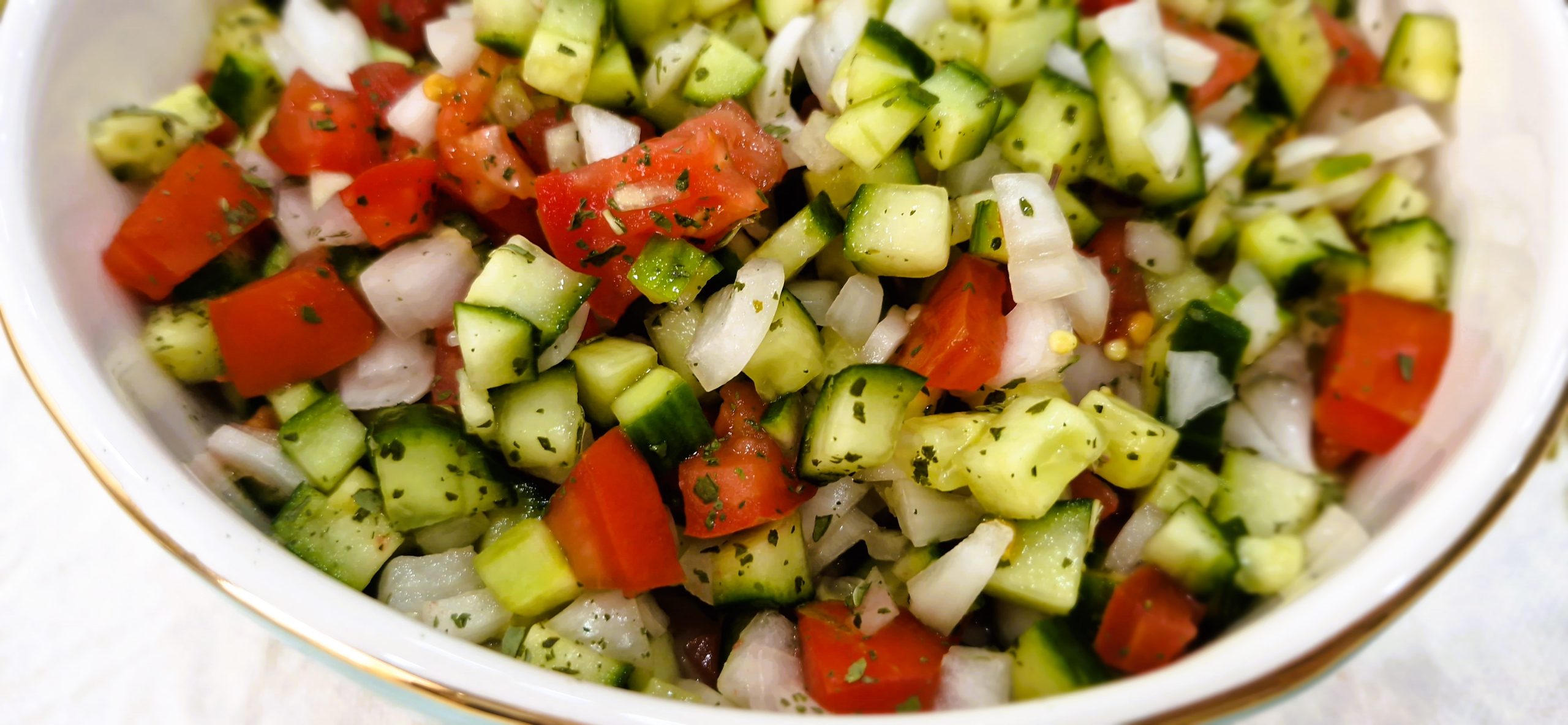Shirazi Salad – Persian Cucumber, Tomato, and Onion Salad Close-up of Shirazi Salad with chopped cucumber, tomatoes, onion, and dried mint