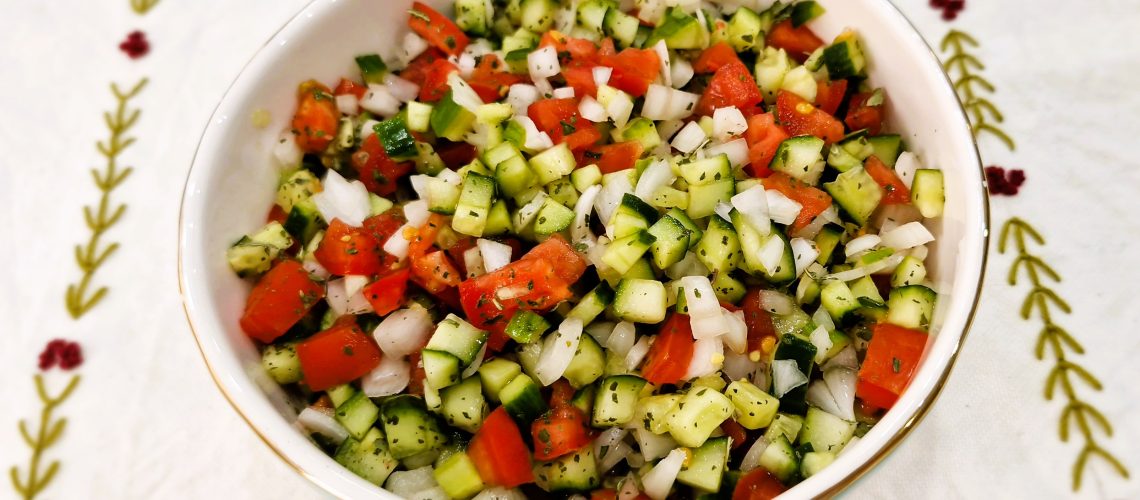 Shirazi Salad with chopped cucumber, tomatoes, onion, and dried mint