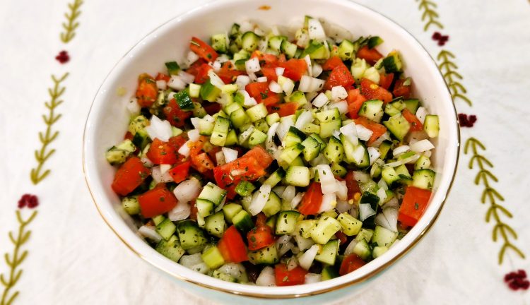 Shirazi Salad with chopped cucumber, tomatoes, onion, and dried mint