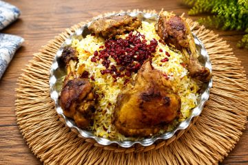 Zereshk Polo Ba Morgh with saffron rice and barberries